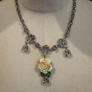 Elegant Silver and Cream Necklace with Floral Pendant